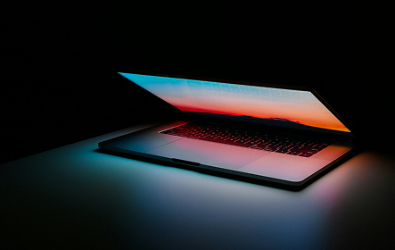 Laptop illuminated with blue and orange light